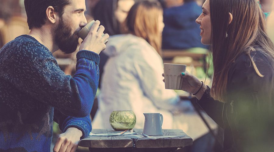 man and woman having coffee